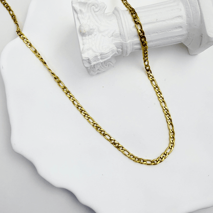 gold figaro link chain necklace with polished interlocking links