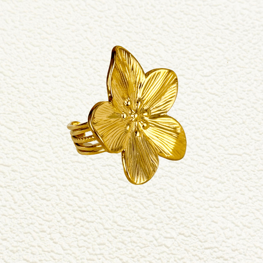 Gold floral adjustable statement ring with large five-petal flower design, PVD gold plated stainless steel, waterproof and hypoallergenic, bold botanical jewelry from MXW Jewellery