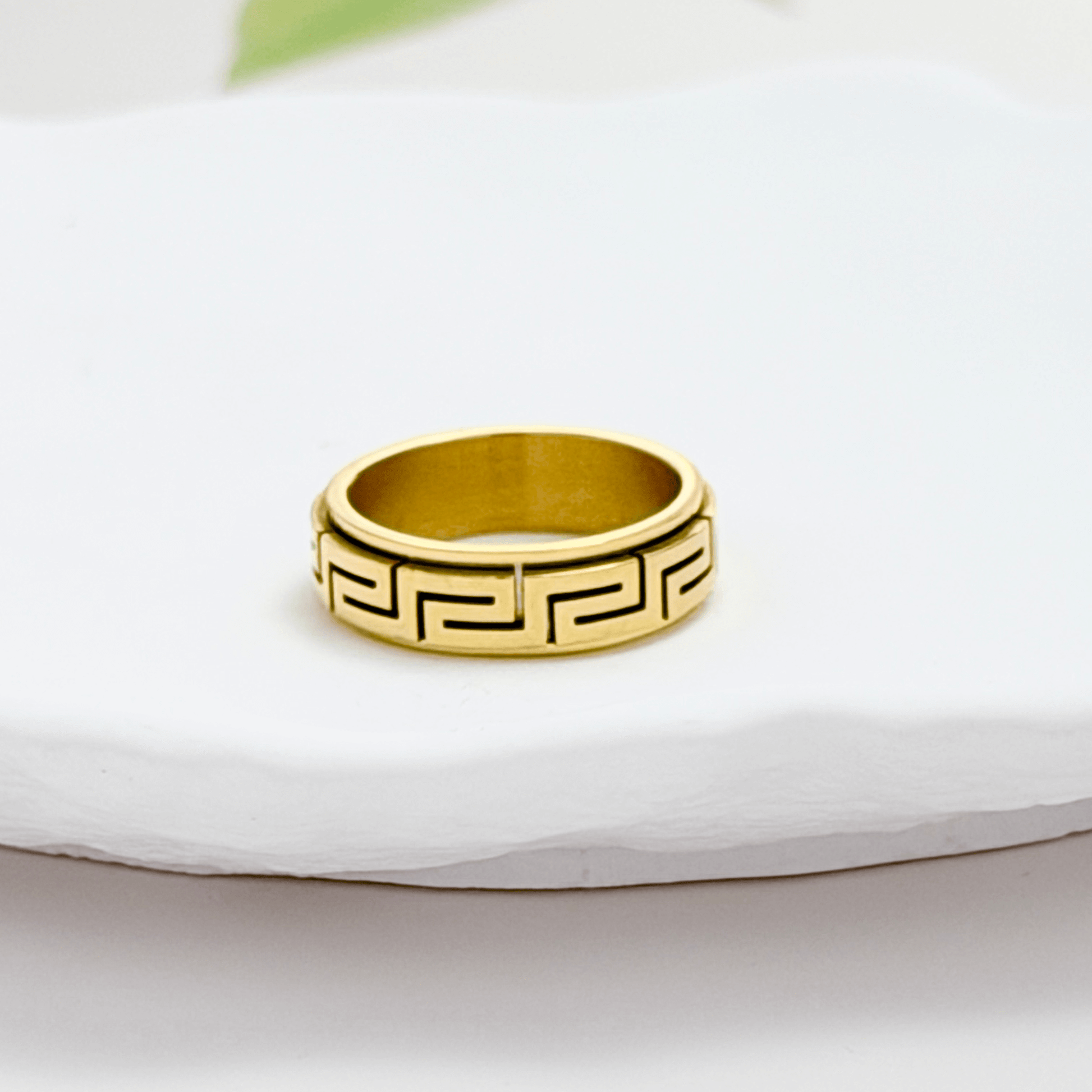 Gold Greek Key Spinner Ring by MXW Jewellery, featuring a rotating band with meander pattern for anxiety relief.