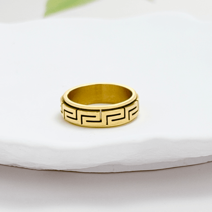 Gold Greek Key Spinner Ring by MXW Jewellery, featuring a rotating band with meander pattern for anxiety relief.