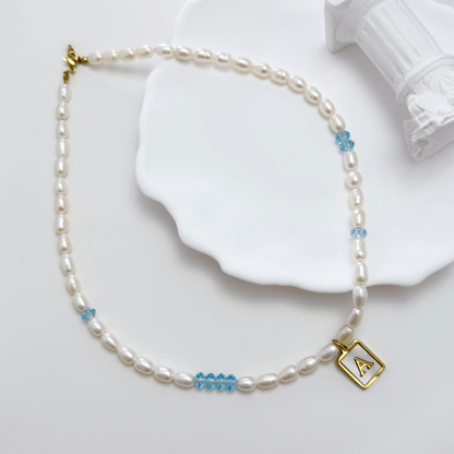 gold initial and birthstone pearl necklace featuring freshwater pearl and Swarovski element crystal, personalised elegant jewellery gift for women