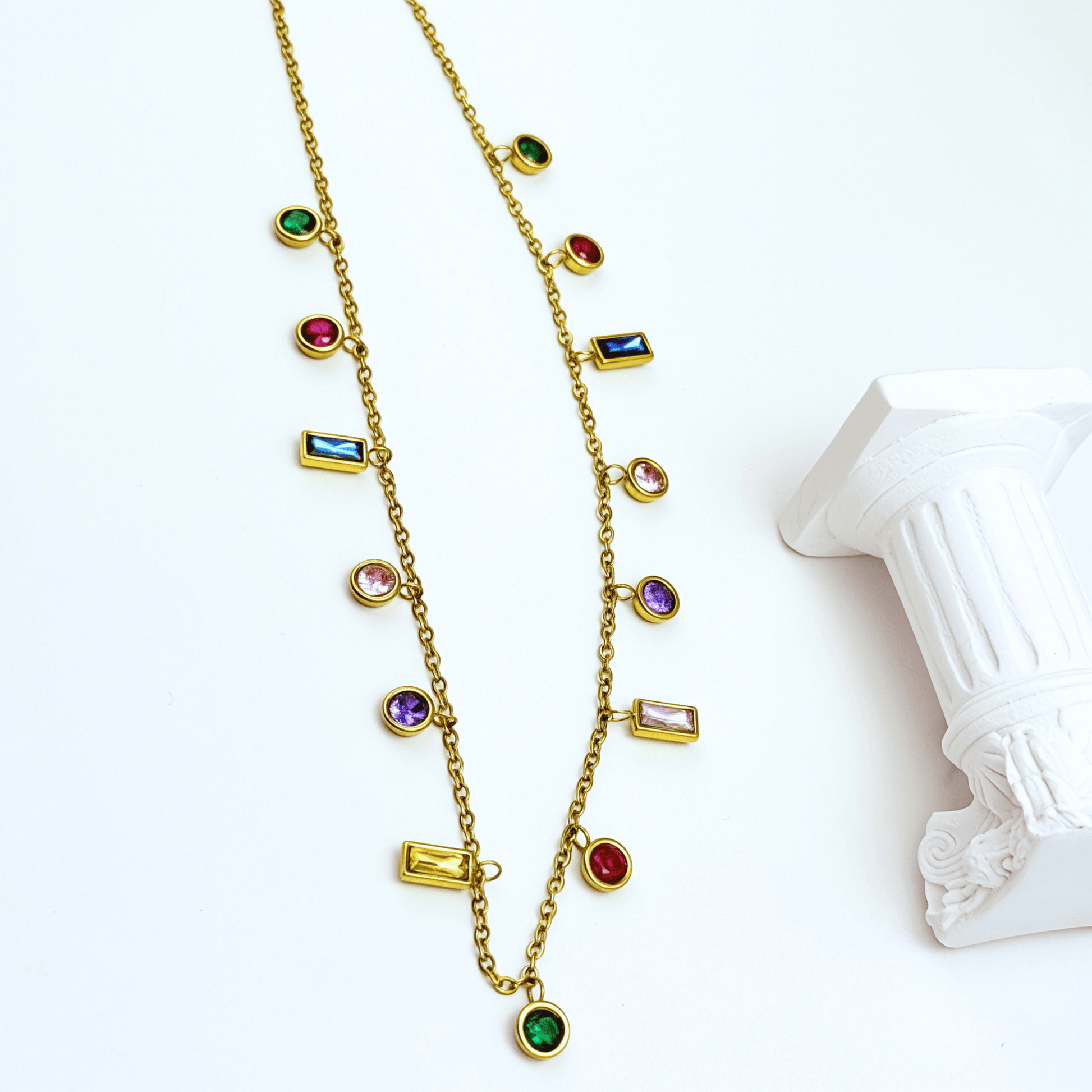 Gold multicolor zircon charm necklace with vibrant crystal accents on a waterproof gold chain.