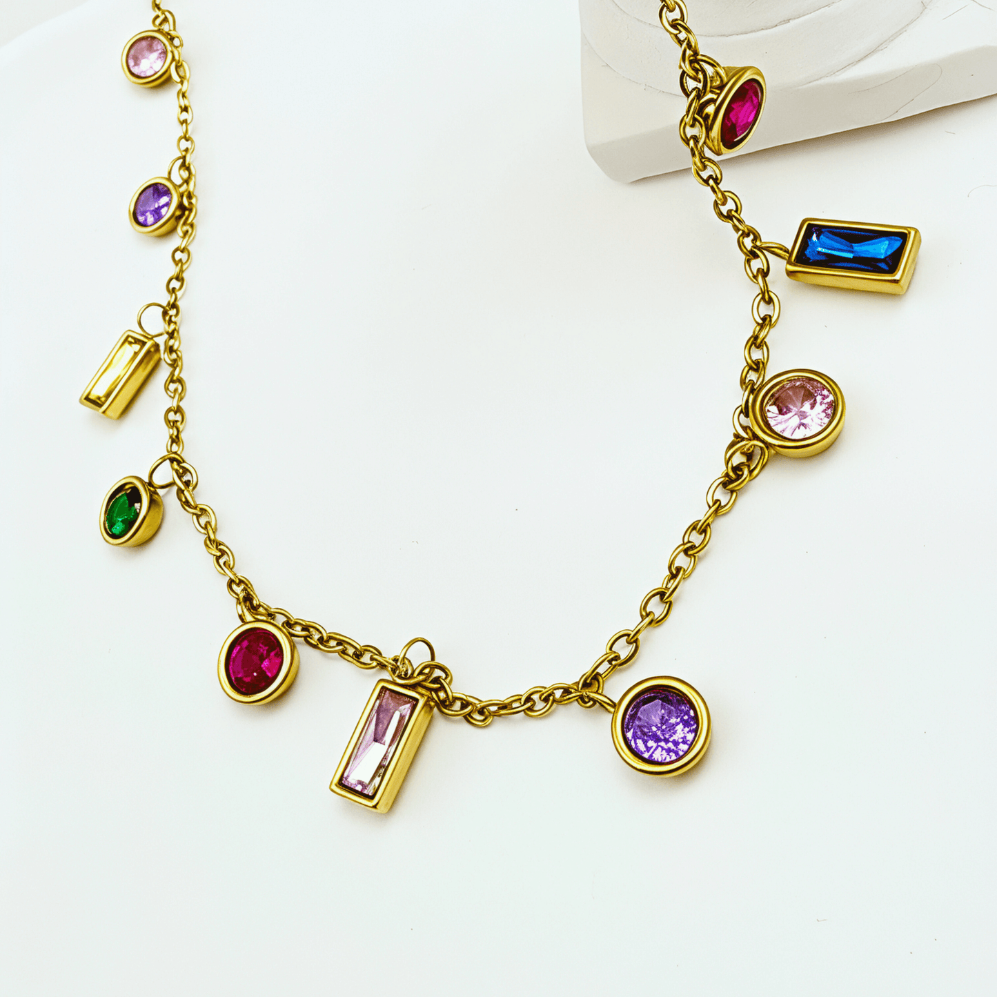 Gold multicolor zircon charm necklace with vibrant crystal accents on a waterproof gold chain.