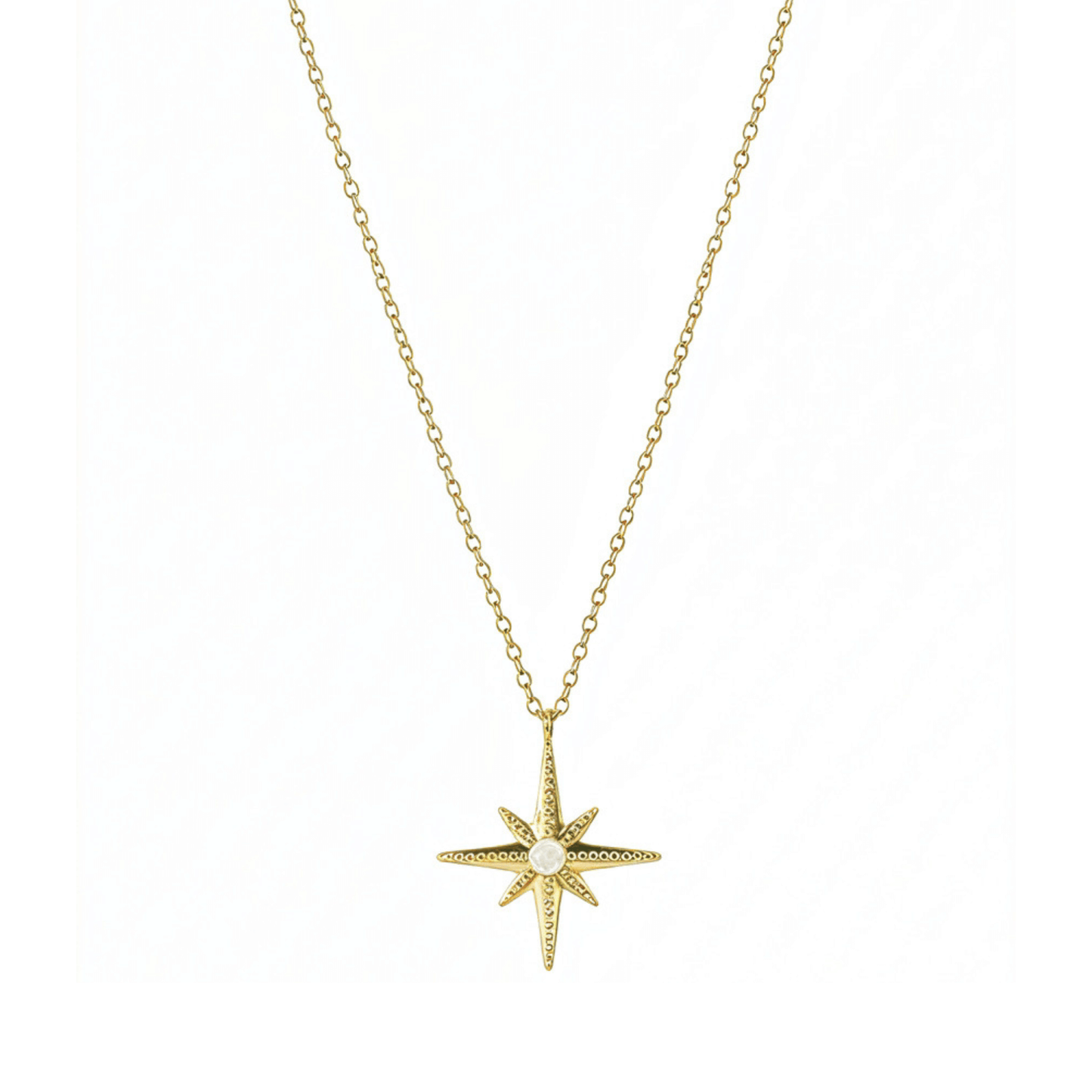 Gold North Star pendant necklace with luminous glass centre, symbolising guidance, balance, and hope.