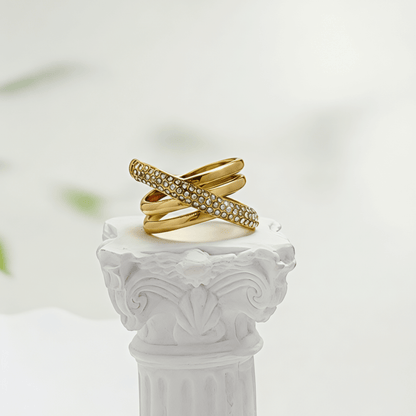 Gold Pave Crossover Ring by MXW Jewellery featuring intertwined gold bands and sparkling crystal pave details.