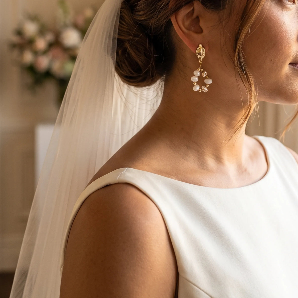 MXW Jewellery Gold vermeil drop earring with freshwater pearls, gold beads and hammered nuggets in an open loop below a textured stud