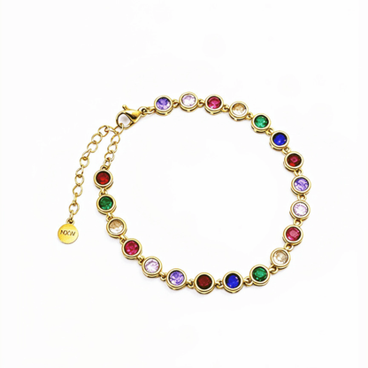 Gold rainbow crystal tennis bracelet with multi-coloured bezel-set stones.