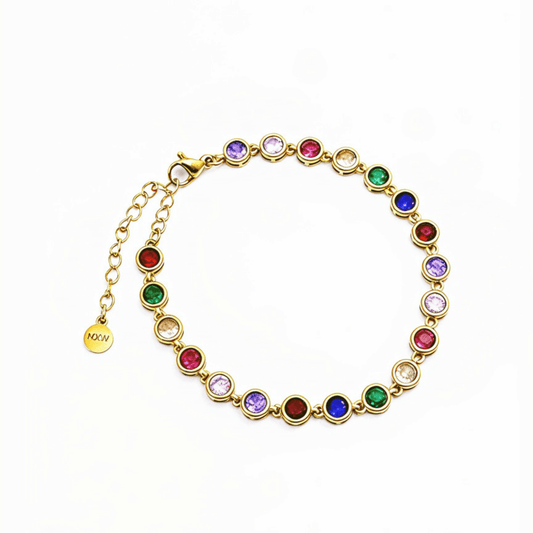 Gold rainbow crystal tennis bracelet with multi-coloured bezel-set stones.