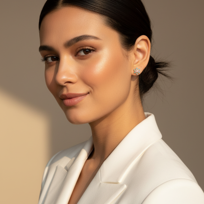 Gold rainbow sunburst crystal stud earrings with multicolour stones in a gold setting.