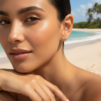 Gold rainbow sunburst crystal stud earrings with multicolour stones in a gold setting.