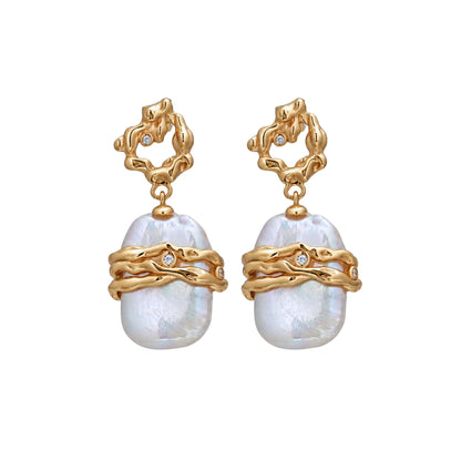 MXW Jewellery Gold vermeil drop earrings with a large baroque freshwater pearl wrapped in textured gold bands below an open molten stud