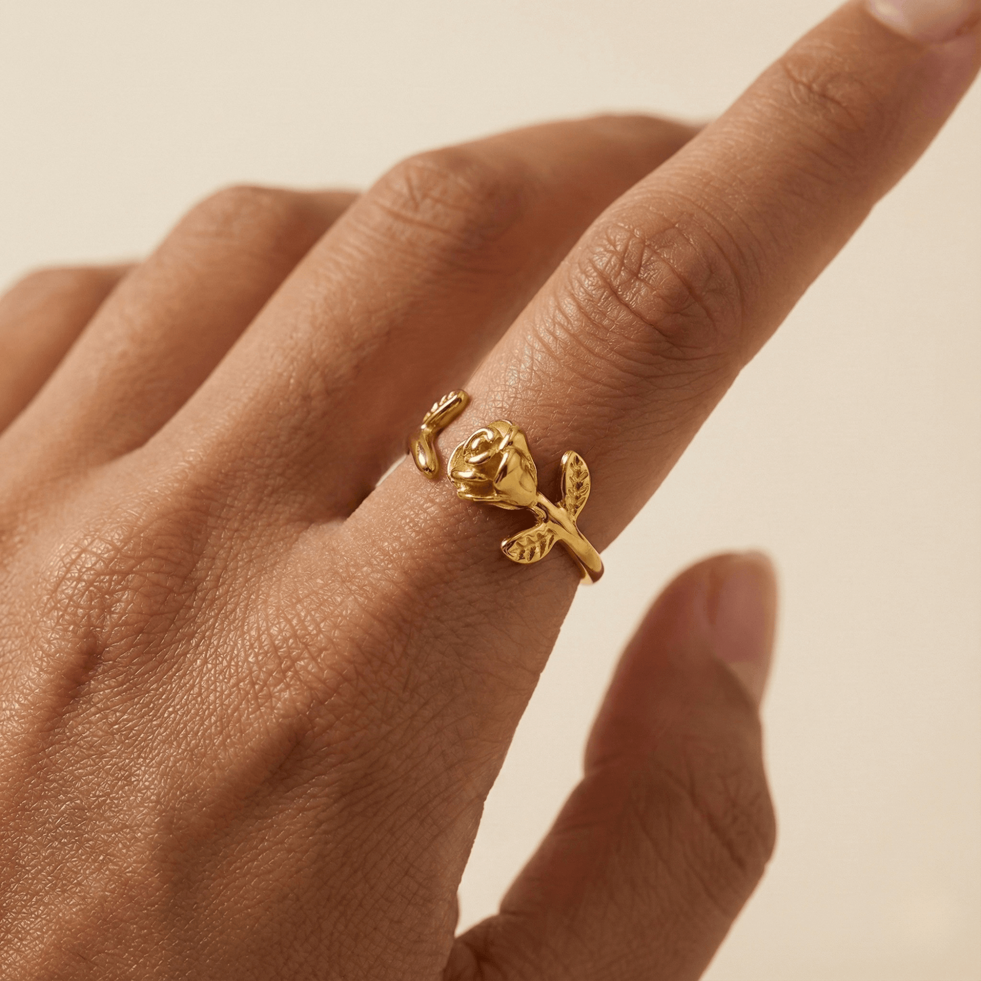 Gold rosebud vine ring with sculpted floral and leaf details, adjustable waterproof gold ring by MXW Jewellery.