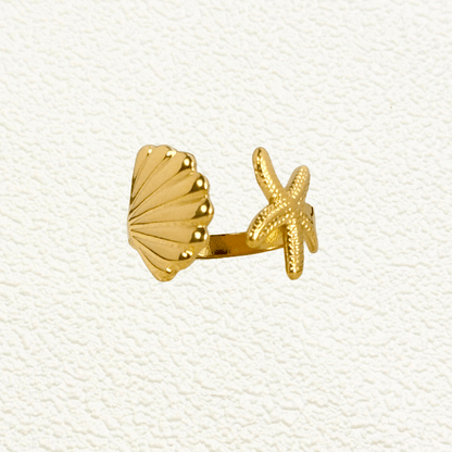 Gold adjustable seashell and starfish ring from MXW Jewellery, crafted in waterproof PVD gold stainless steel,