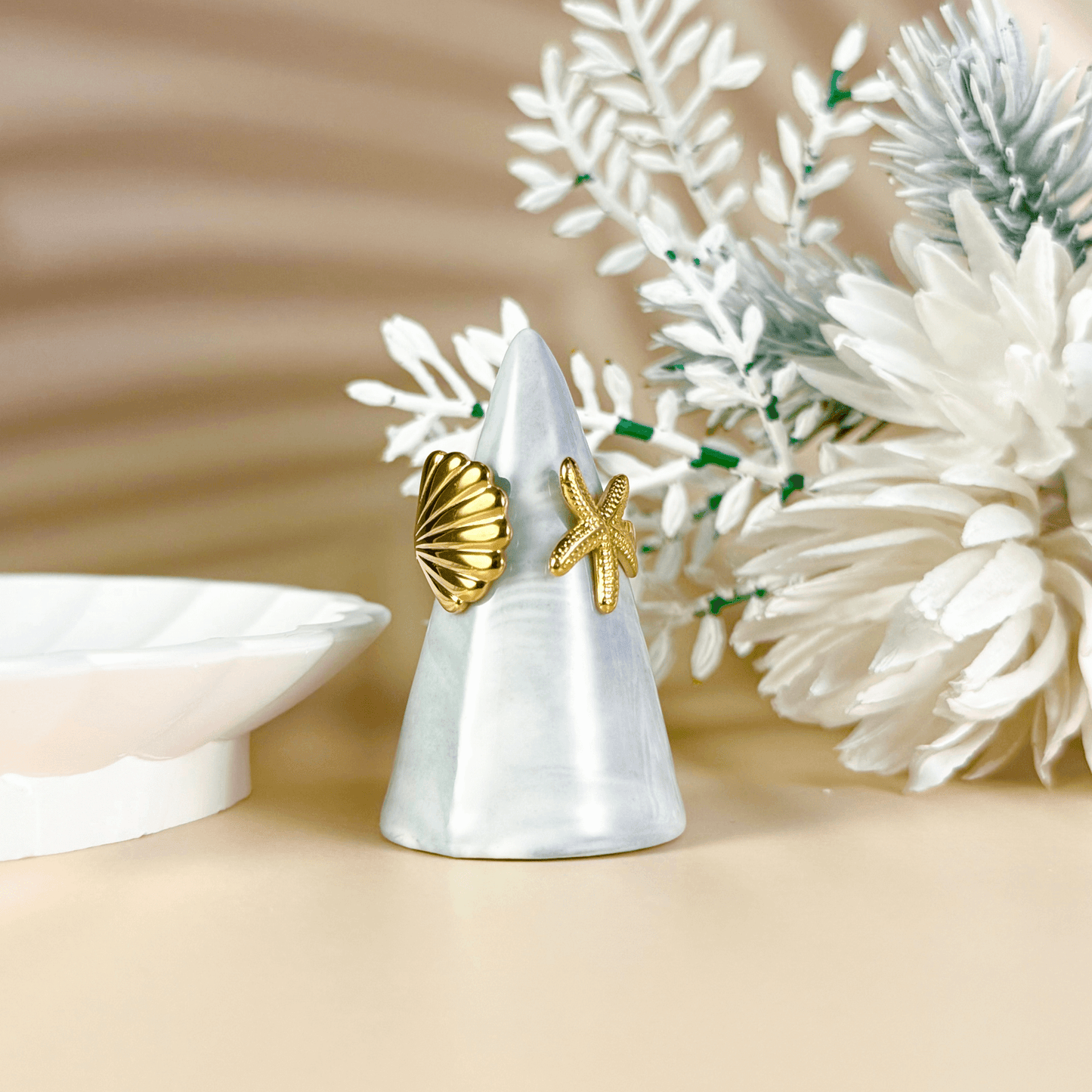 Gold adjustable seashell and starfish ring from MXW Jewellery, crafted in waterproof PVD gold stainless steel,