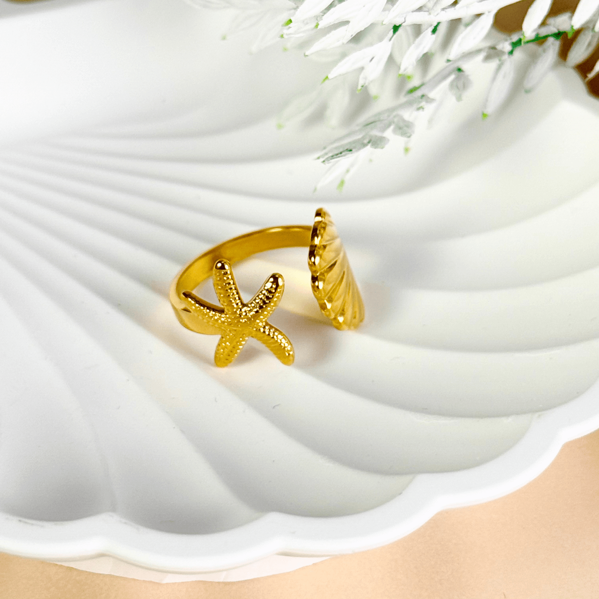 Gold adjustable seashell and starfish ring from MXW Jewellery, crafted in waterproof PVD gold stainless steel,