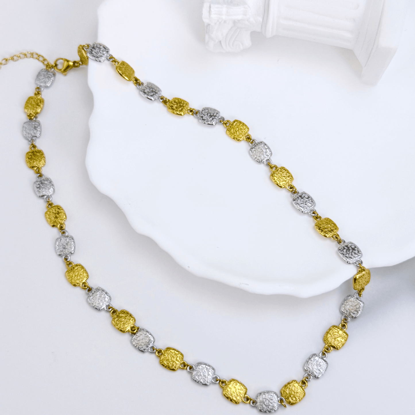 Gold and silver textured square link chain necklace featuring alternating two-tone engraved links with a classic, polished finish.