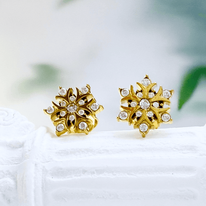 Gold sunburst crystal stud earrings with sparkling round crystals.