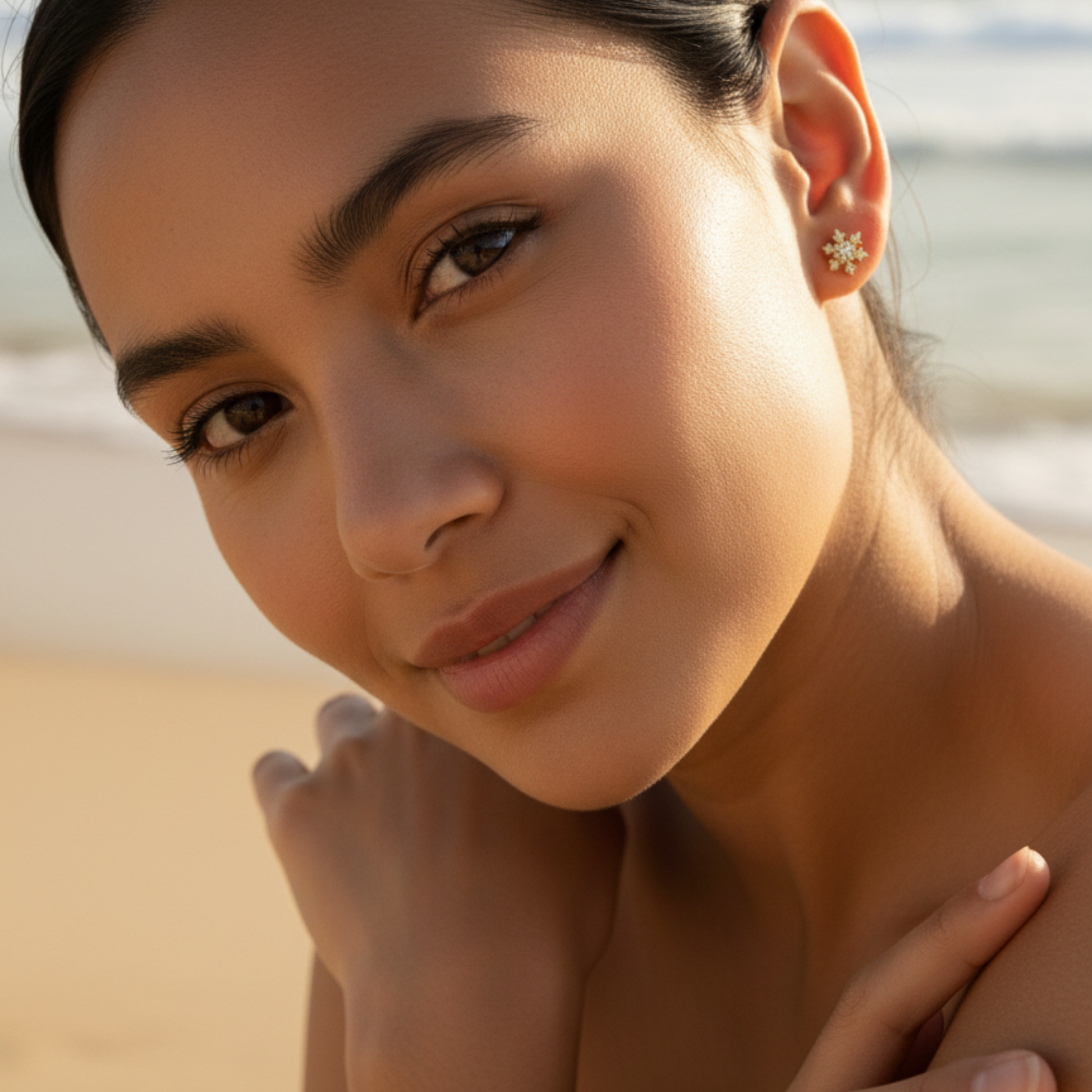 Gold sunburst crystal stud earrings with sparkling round crystals.