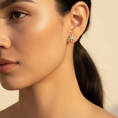 Gold sunburst crystal stud earrings with sparkling round crystals.