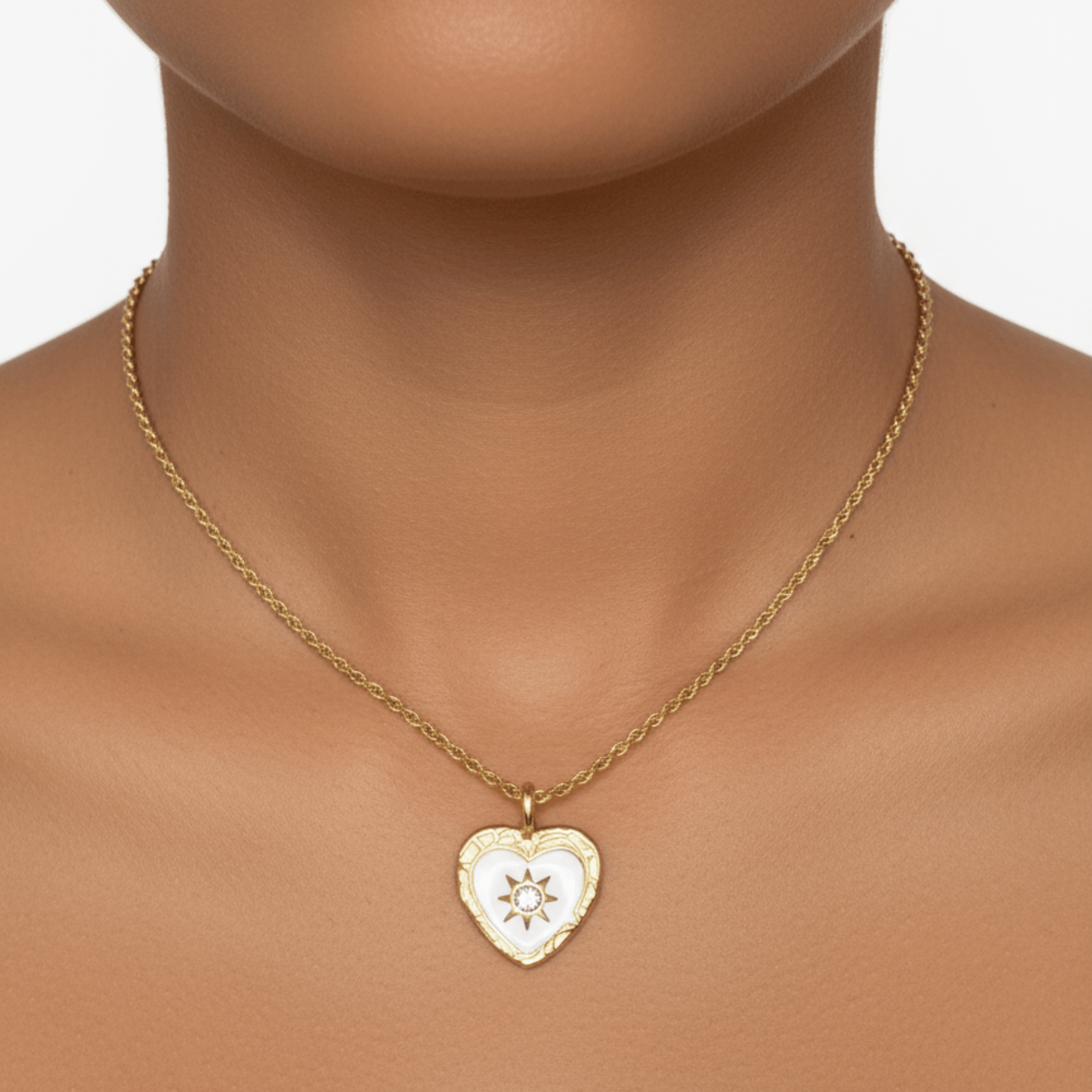 Gold sunburst heart zircon necklace with white enamel, waterproof and tarnish-resistant, perfect for everyday wear.