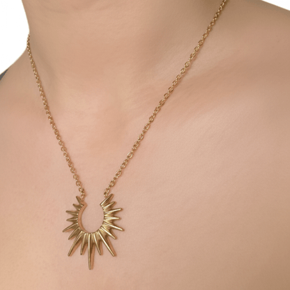 Waterproof gold sunburst necklace with radiant crescent pendant, crafted in 18K gold-plated stainless steel for an elegant celestial look.