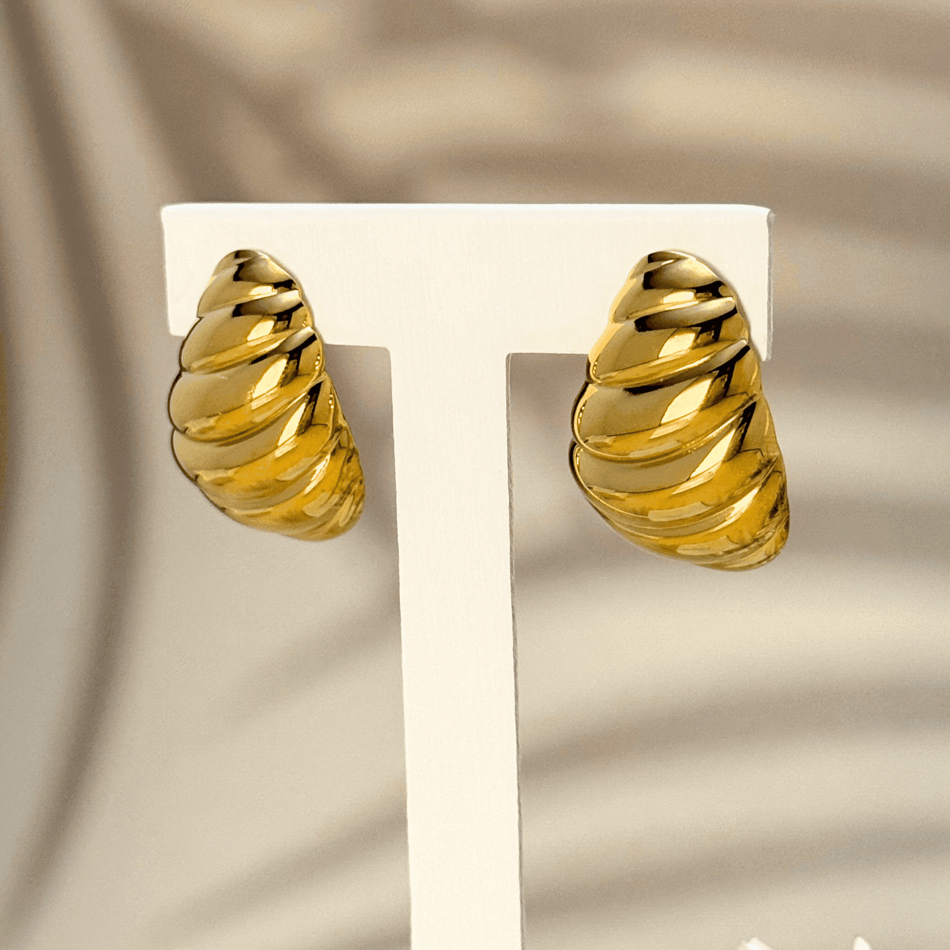 Gold swirl sculpted statement earrings, waterproof and tarnish-resistant, featuring a bold twisted design for a vintage-inspired yet modern look. Perfect for all-day wear.