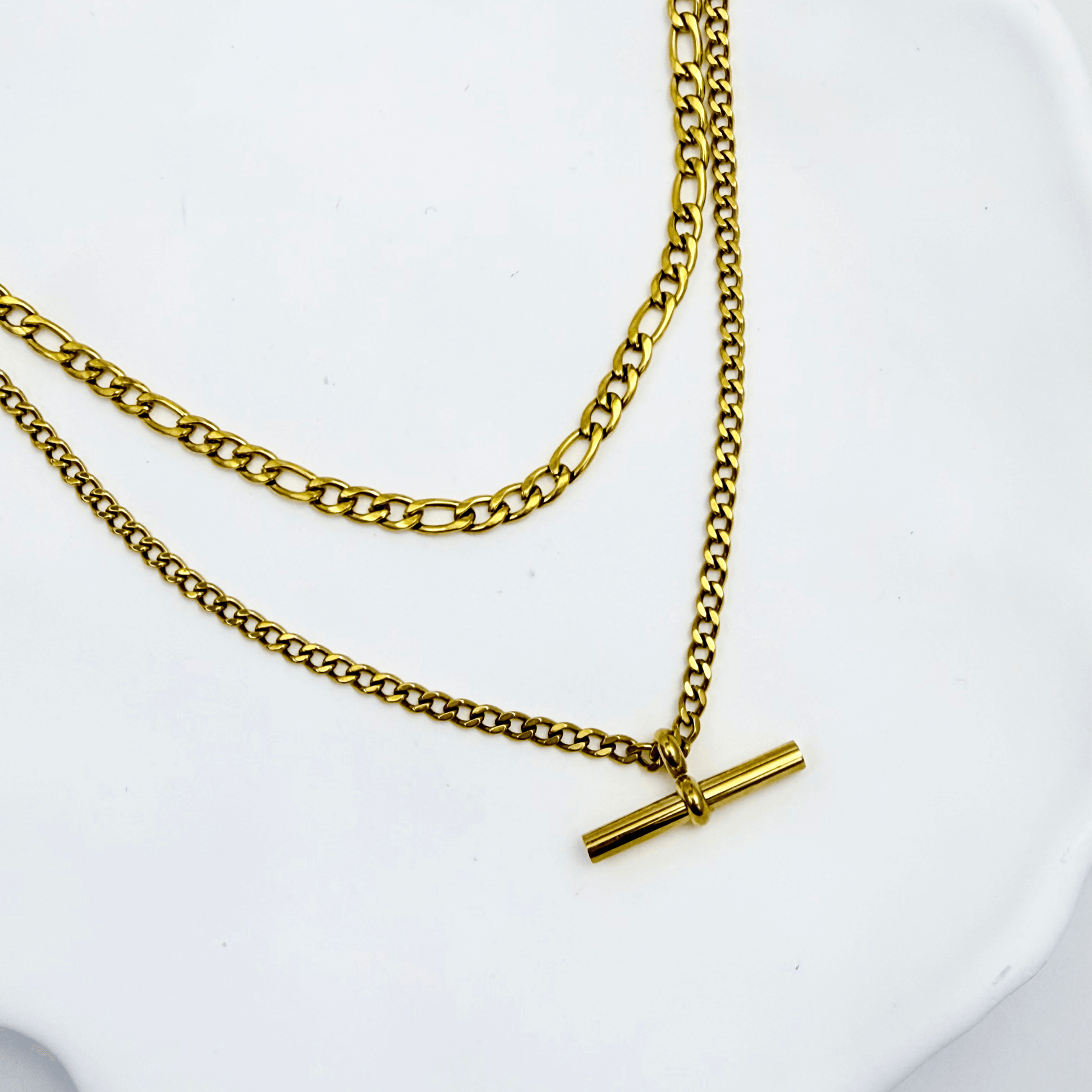 Gold double-layer necklace with curb chain and T-bar pendant