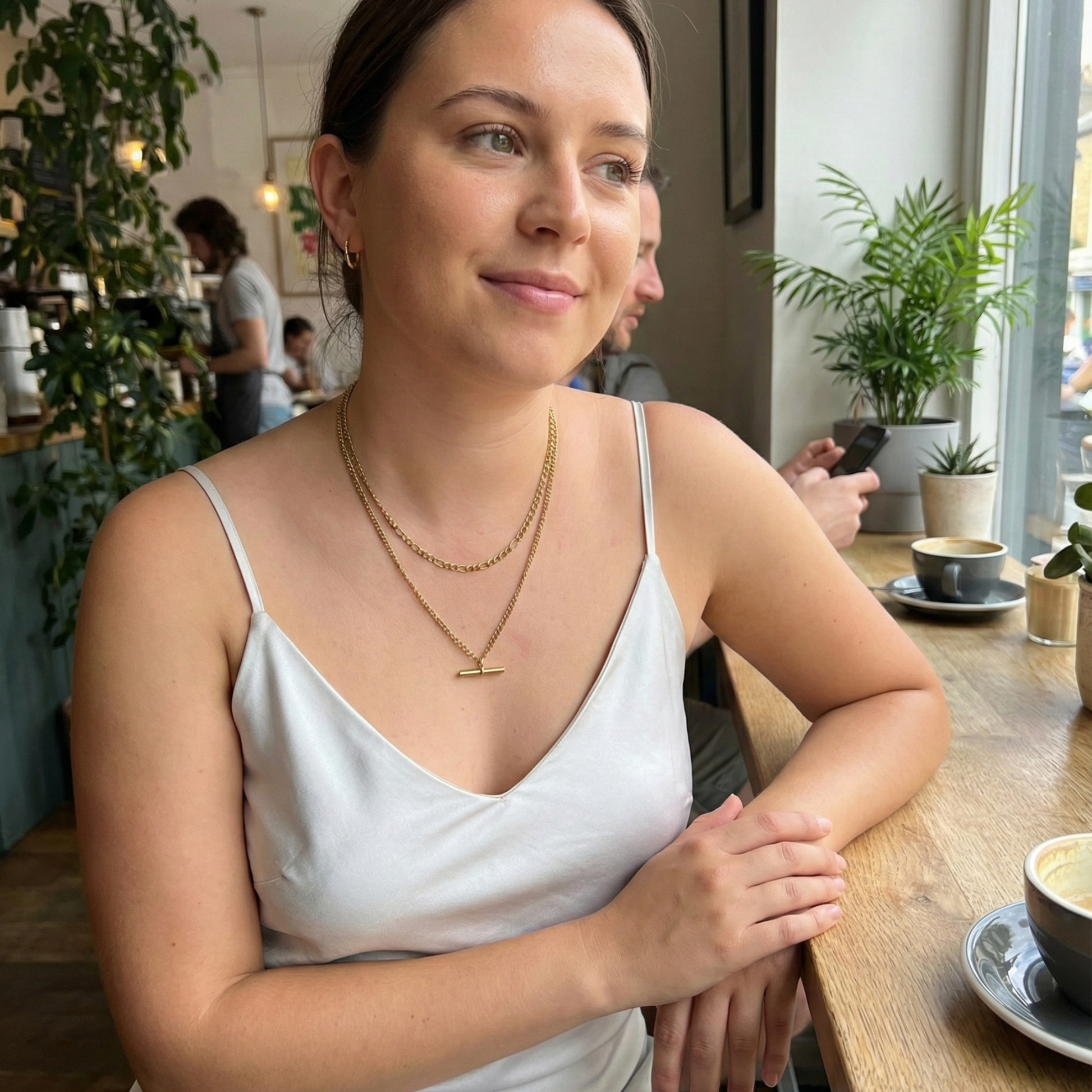 Gold double-layer necklace with curb chain and T-bar pendant