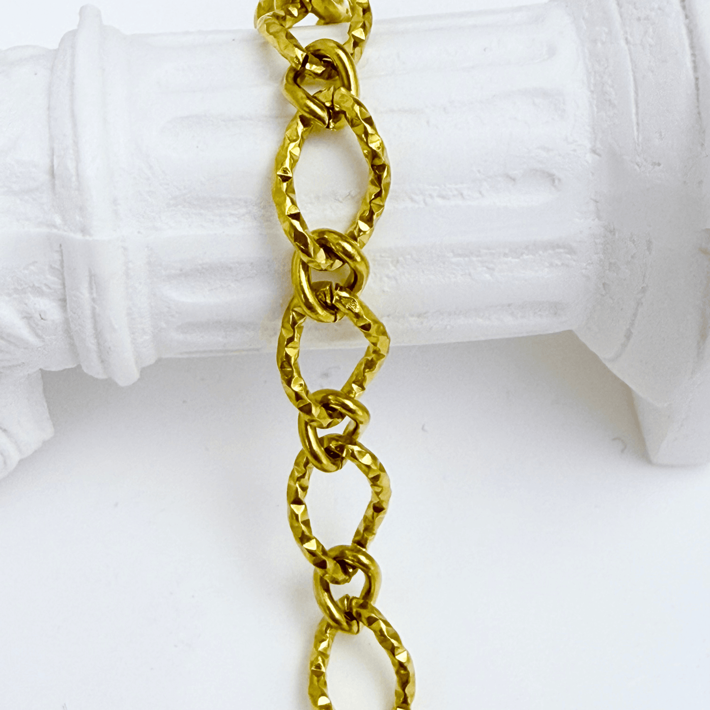 Gold textured chain bracelet featuring faceted loop links and adjustable extender, modern minimalist jewellery.