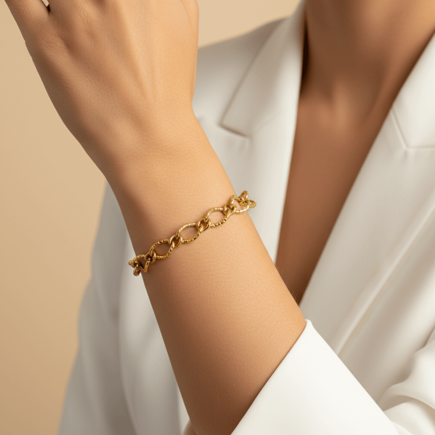 Gold textured chain bracelet featuring faceted loop links and adjustable extender, modern minimalist jewellery.
