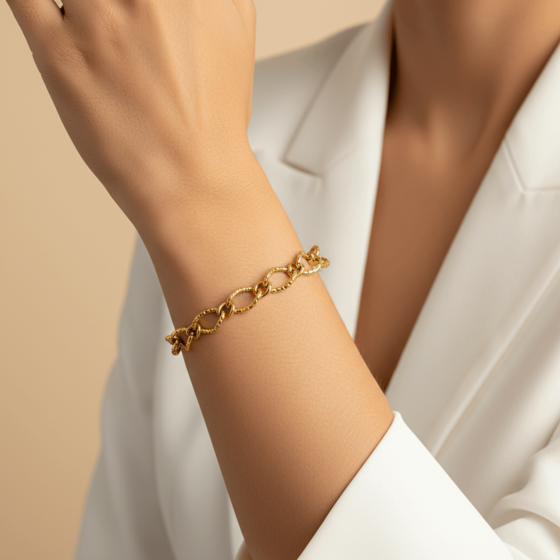 Gold textured chain bracelet featuring faceted loop links and adjustable extender, modern minimalist jewellery.