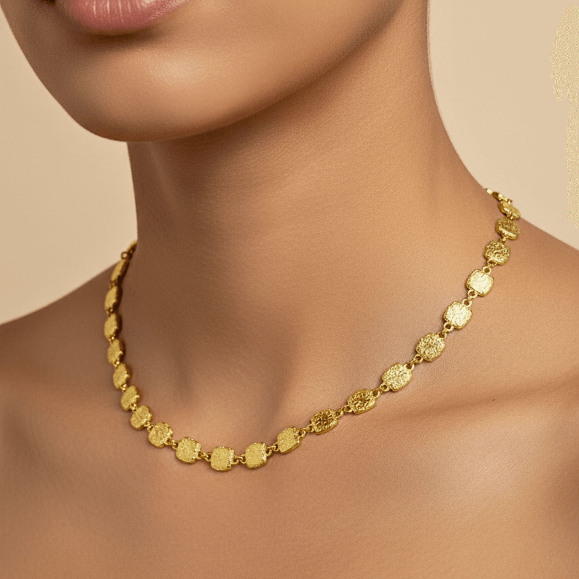 Gold textured square link chain necklace featuring small engraved square links connected in a continuous gold pattern.