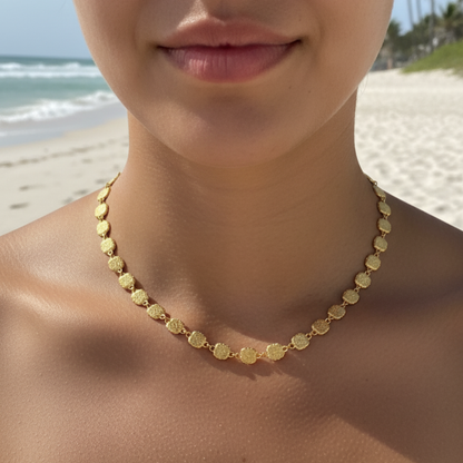 Gold textured square link chain necklace featuring small engraved square links connected in a continuous gold pattern.