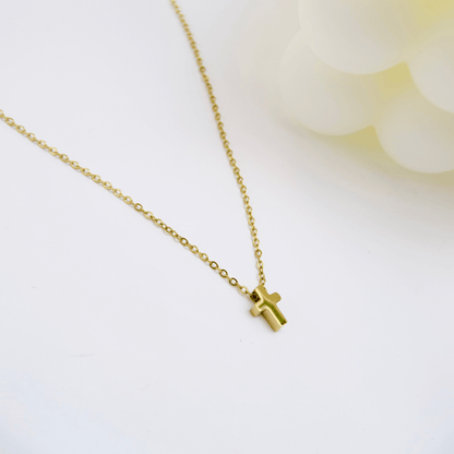 Gold tiny cross necklace symbolising faith and grace – MXW Jewellery