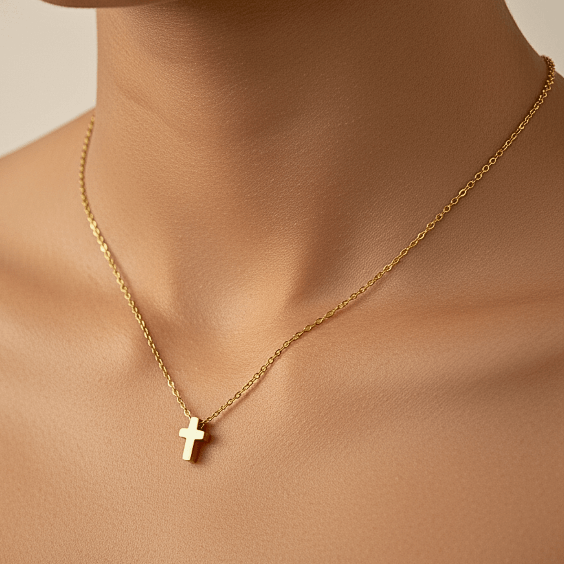 Gold tiny cross necklace symbolising faith and grace – MXW Jewellery