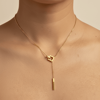 gold unity link necklace with interlocking geometric shapes symbolising connection and strength