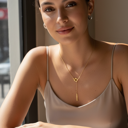 gold unity link necklace with interlocking geometric shapes symbolising connection and strength