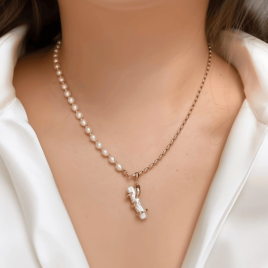 necklace with gold vine-wrapped pearl pendant on half pearl, half gold beaded chain