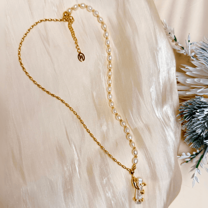 necklace with gold vine-wrapped pearl pendant on half pearl, half gold beaded chain