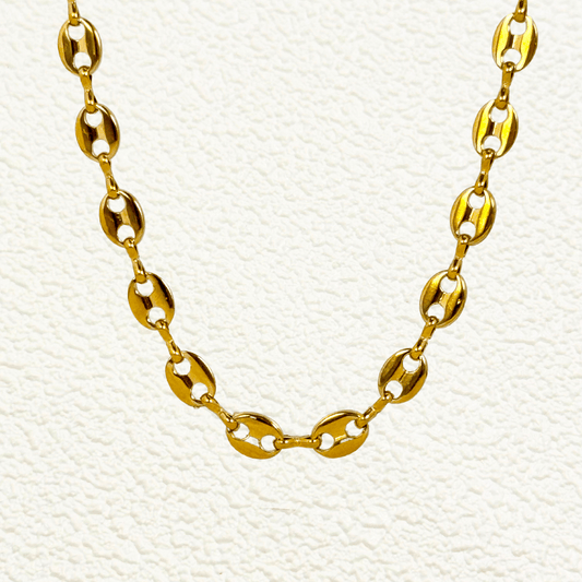 Gold coffee bean link chain with oval polished links in waterproof stainless steel.