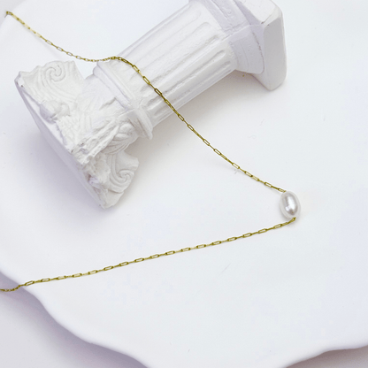 Dainty gold chain necklace with single freshwater pearl, minimalist waterproof design for layering or everyday wear.