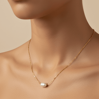 Dainty gold chain necklace with single freshwater pearl, minimalist waterproof design for layering or everyday wear.