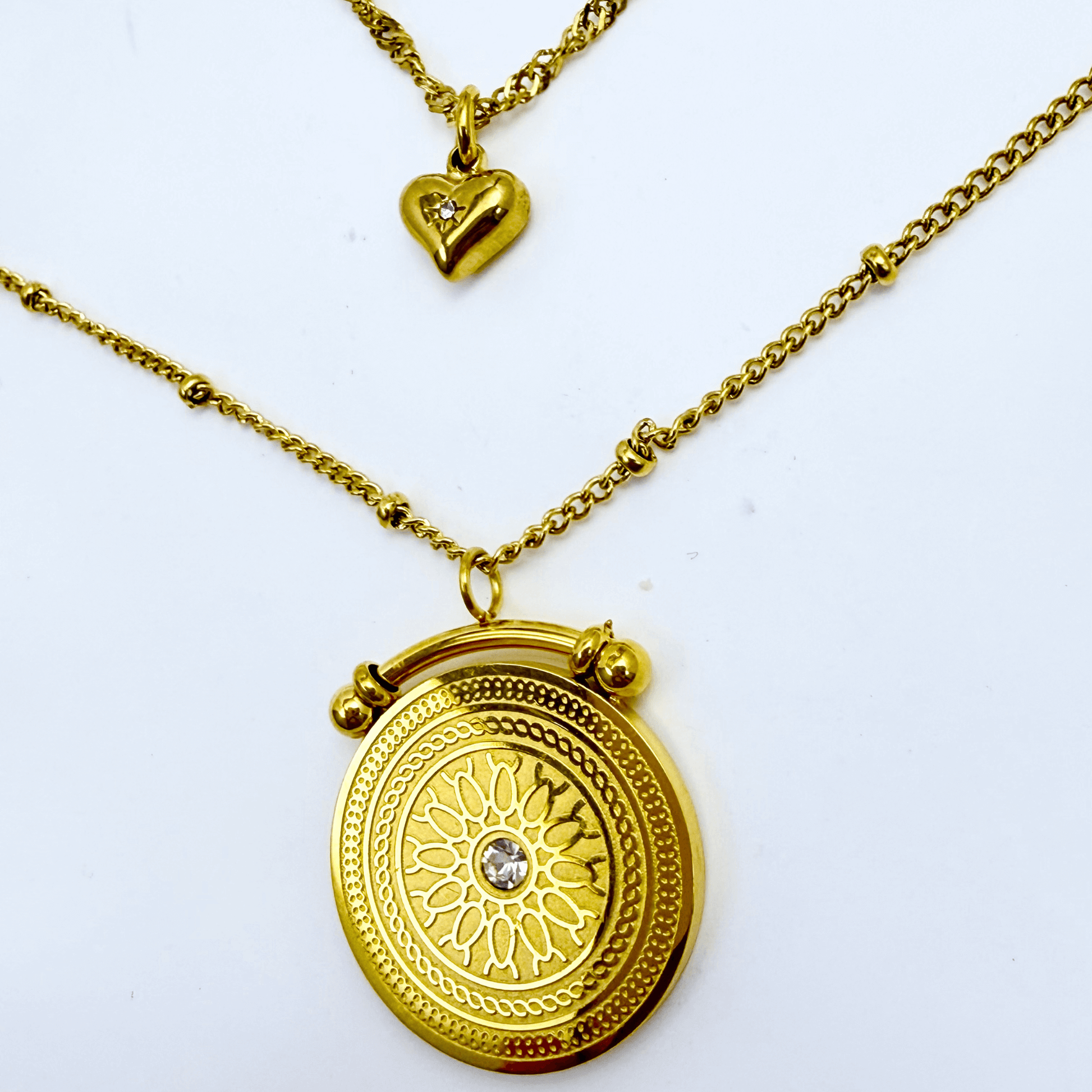 Gold double-layer necklace with heart charm and mandala pendant