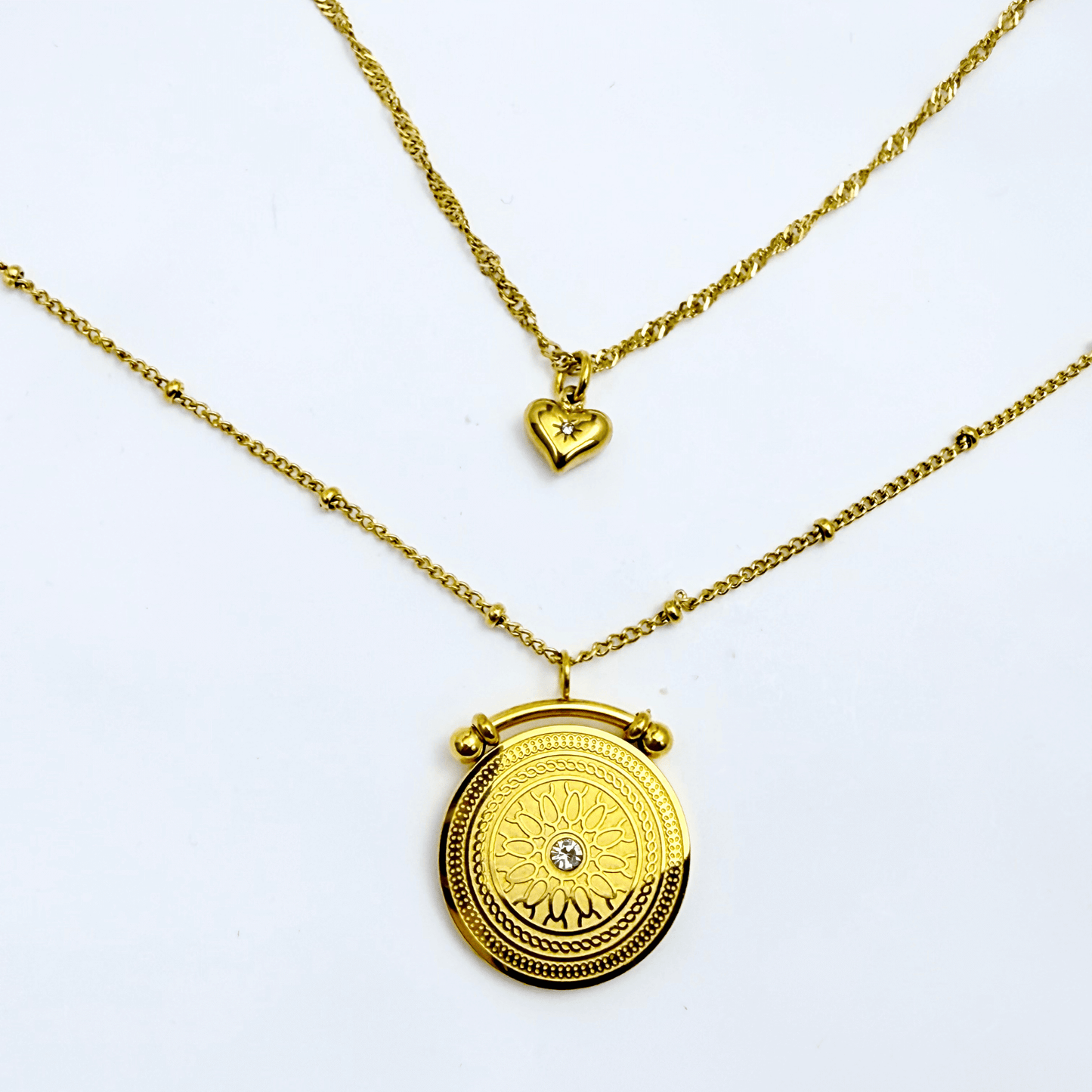 Gold double-layer necklace with heart charm and mandala pendant
