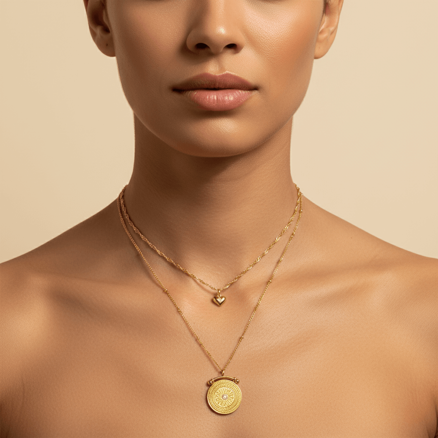Gold double-layer necklace with heart charm and mandala pendant