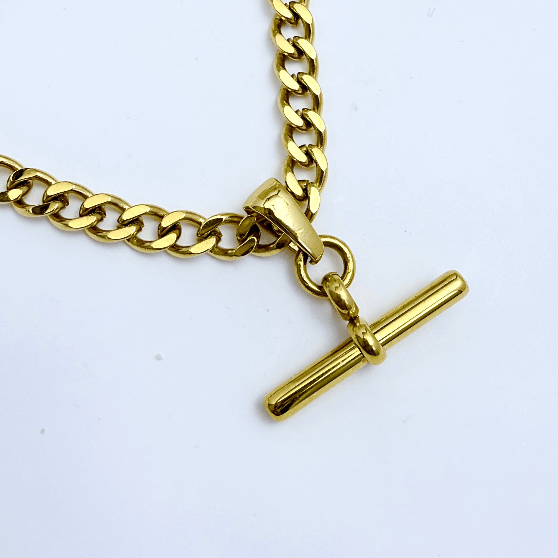 gold t-bar curb chain necklace with polished bar pendant