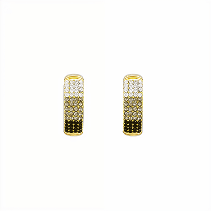 Gradient black pavé gold huggie earrings with ombré crystals.