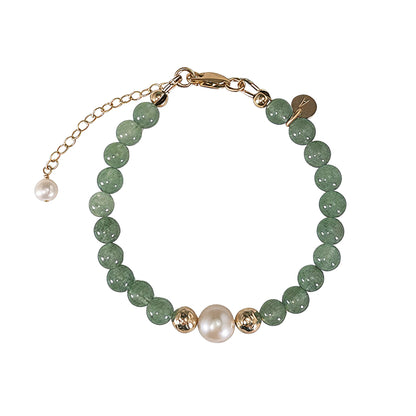 Green aventurine, pearl and initial gold bracelet featuring polished green gemstone beads, lustrous freshwater pearls and a personalised gold-filled stamped initial disc.