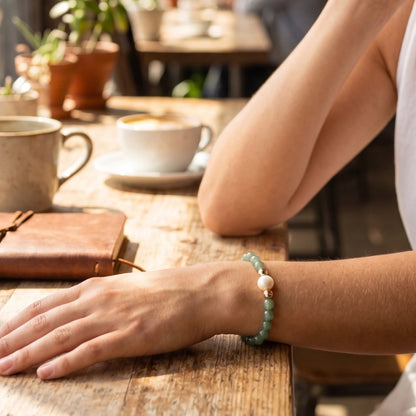 Green aventurine, pearl and initial gold bracelet featuring polished green gemstone beads, lustrous freshwater pearls and a personalised gold-filled stamped initial disc.