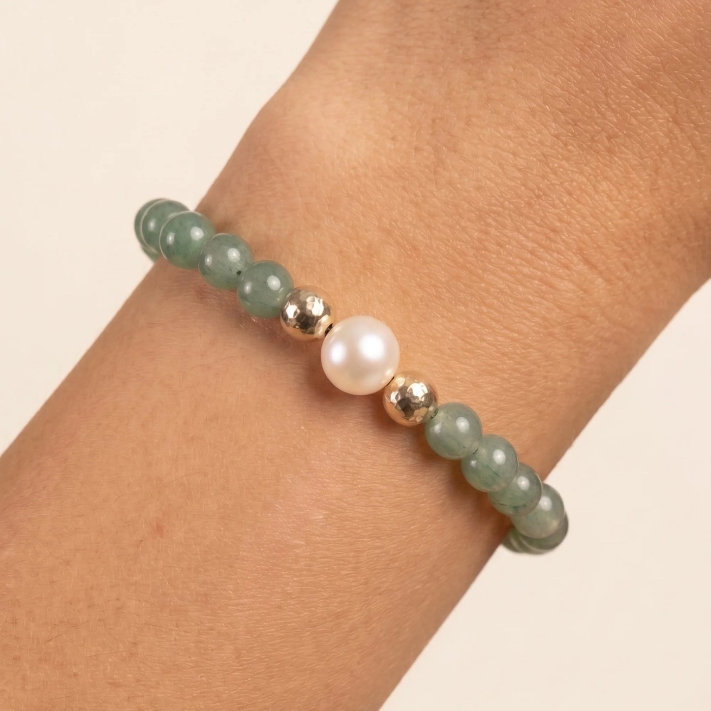 Green aventurine, pearl and initial gold bracelet featuring polished green gemstone beads, lustrous freshwater pearls and a personalised gold-filled stamped initial disc.